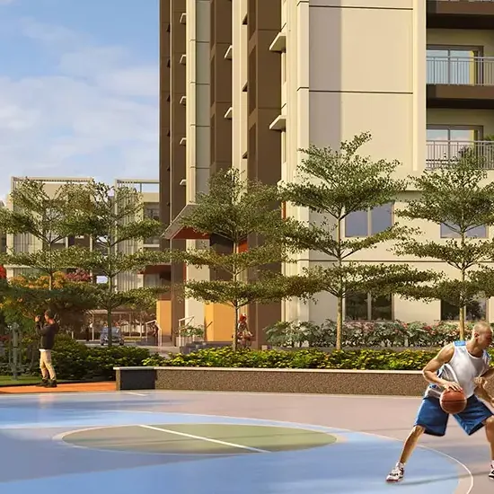 A basketball court among trees and towers at Brigade Citadel