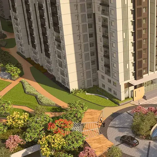 A landscaped drop-off court below the towers at Brigade Citadel